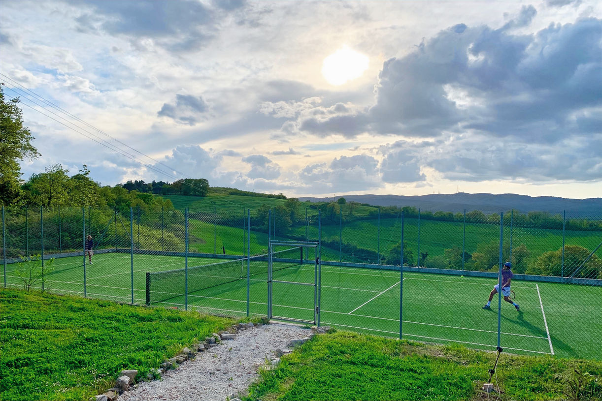 Private tennis court surrounded by the Umbrian countryside