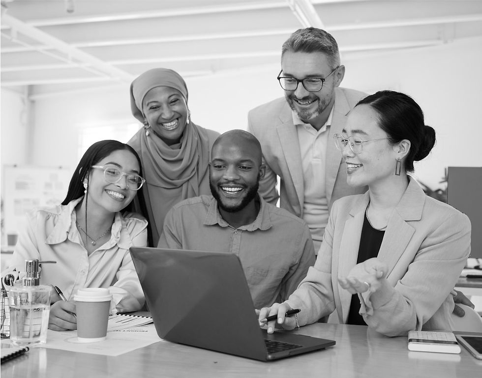 Diverse team collaborating happily in a modern office, showcasing inclusive hiring.