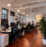 Moonbug APAC open office with desks, computers, and employees working. Careers at Moonbug.