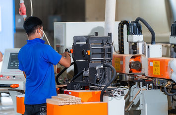 man working with shaping machine
