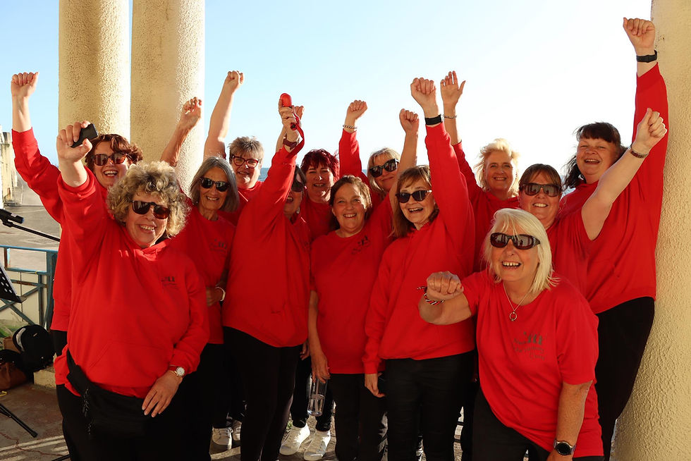 Women Rockin' Harmony Choirs® having fun performing at Blackpool Race For Life. 2025.