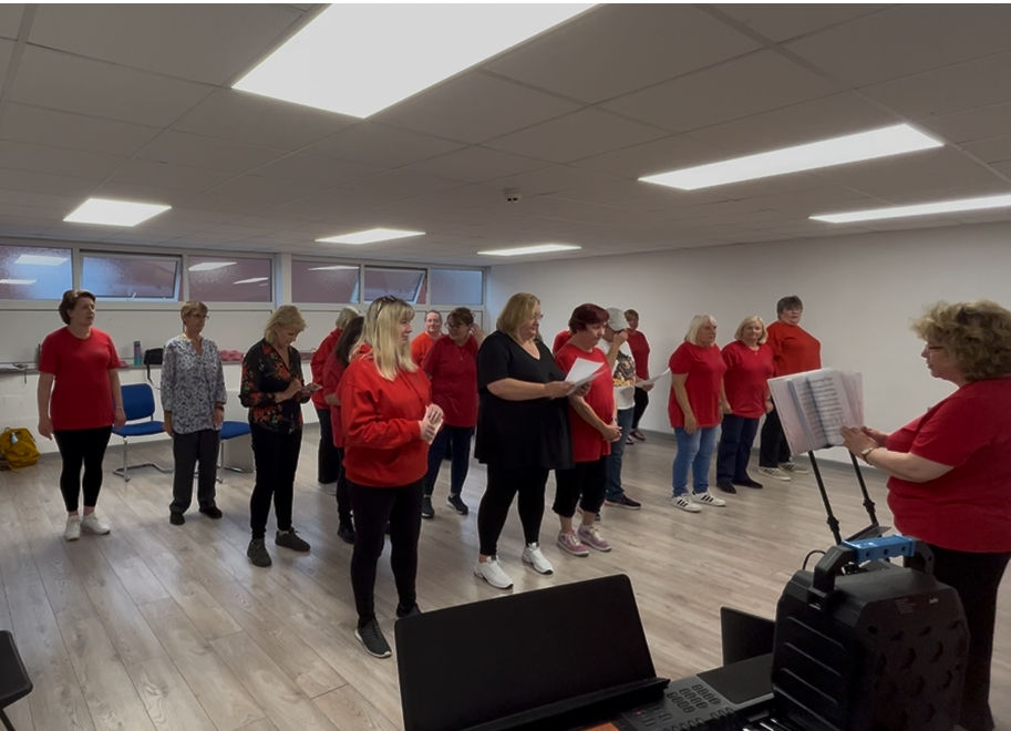 Women Rockin' Harmony Choir rehearsing at Scream Theatre Schools Blackpool