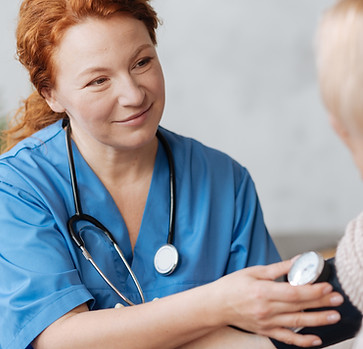 Nurse checking blood pressure