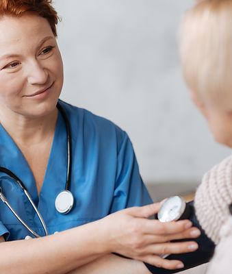 Nurse checking blood pressure