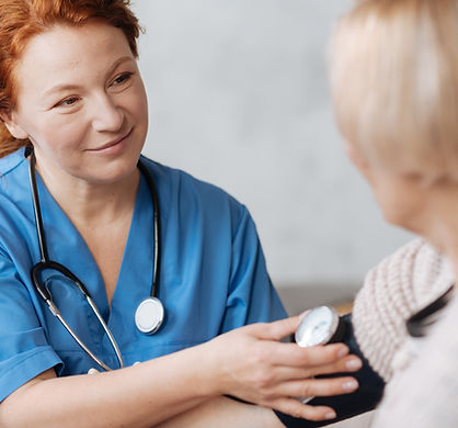 Nurse checking blood pressure