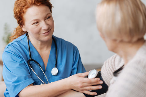 Nurse checking blood pressure