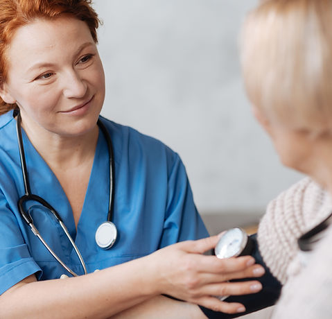 Nurse checking blood pressure