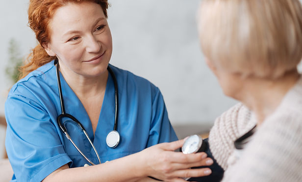 Nurse checking blood pressure