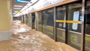 Floodwaters submerge China train station