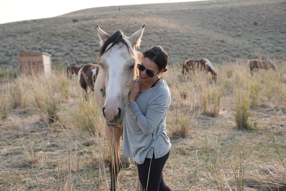Cowgirl snuggling her horse after a hard days work at the Silver Spur Ranch.