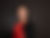photo of a beautiful woman in a red top posing for a corporate headshot