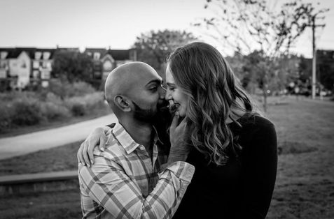 Engagement photo of bride and groom with relaxed waves