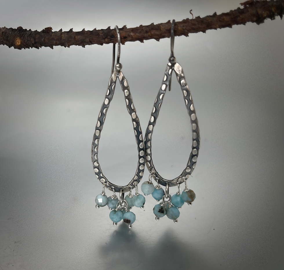 Thumbnail: Sterling silver and Larimar teardrop shaped dangle earrings.
