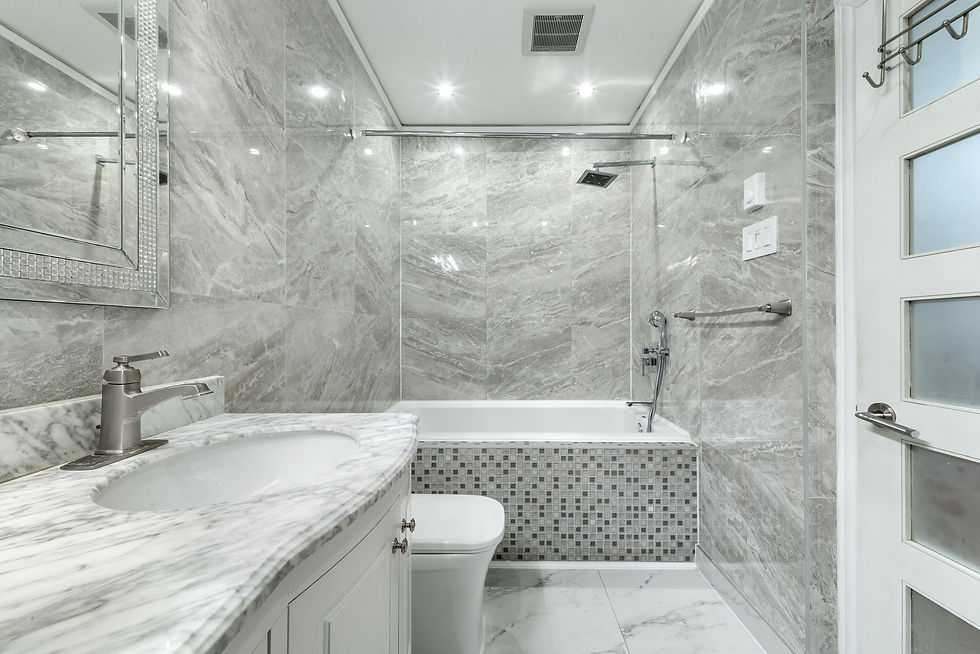 Stunning bathroom with gray marble tile walls and mosaic bathtub surround – Tile installation in Cha