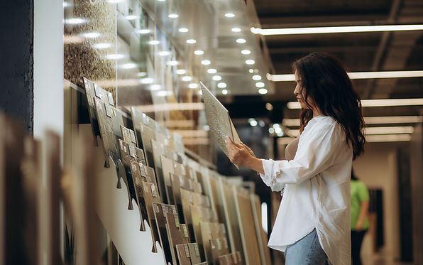 Customer selecting tile at a showroom for a custom tile installation project with Chattanooga Tile Company in Chattanooga, Tennessee.