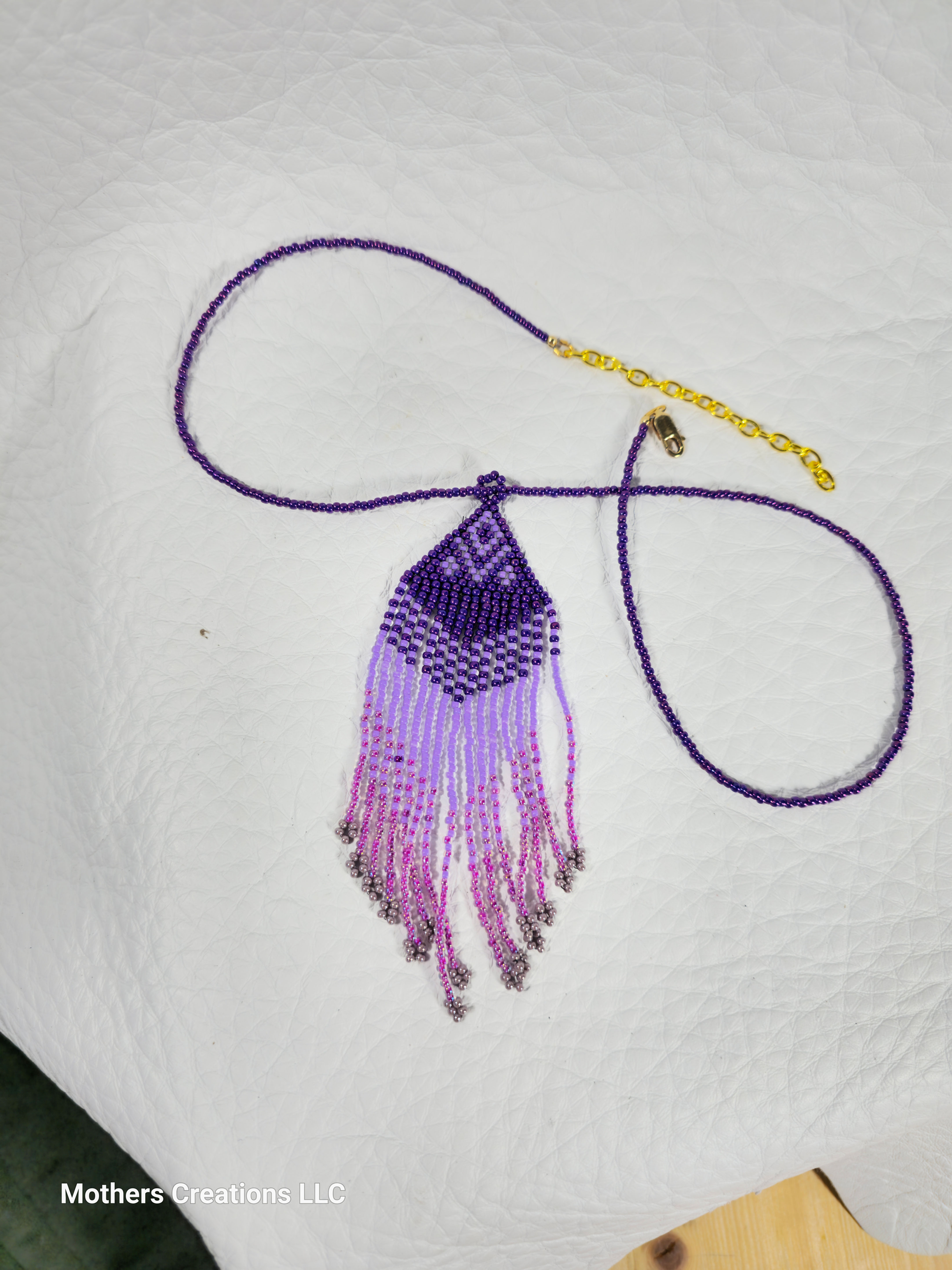 Purple Rain necklace full view on leather