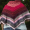 Thumbnail: Fiery Shawl hanging on shoulders
