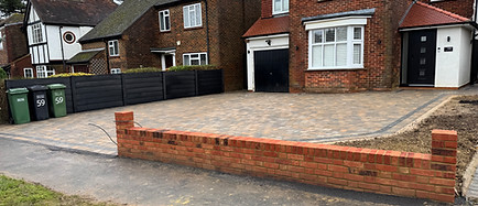 Front boundary makeover with a fresh red brick wall and grass restoration outside a residential property.
