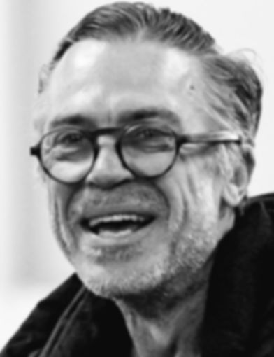 Philip stand in b&w headshot for web.jpg