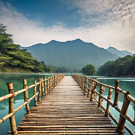 bamboo bridge centered over blue lake with mountains on either side.jpg