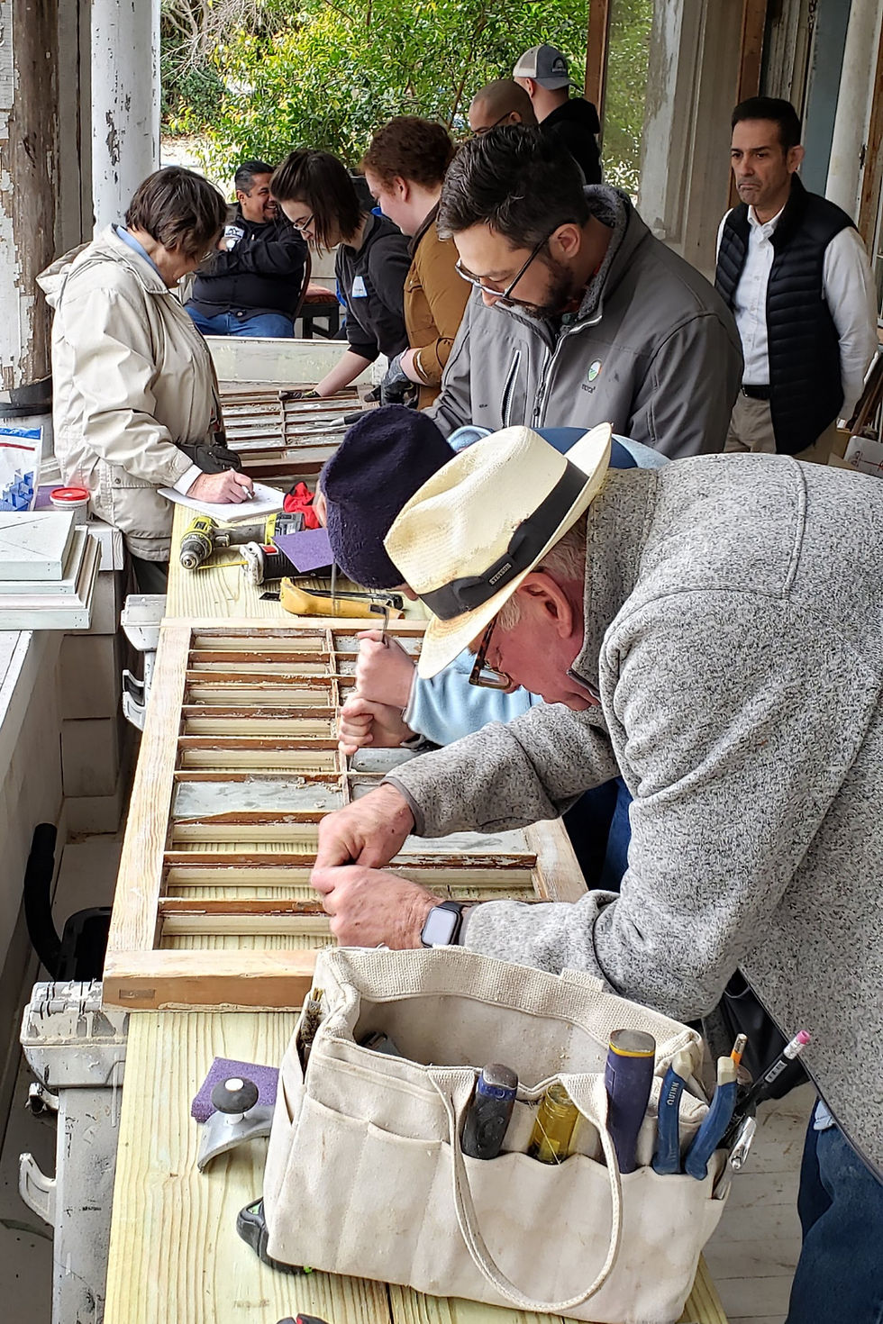 Students practicing their wood window sash restoration skills at a San Antonio, Texas Workshop