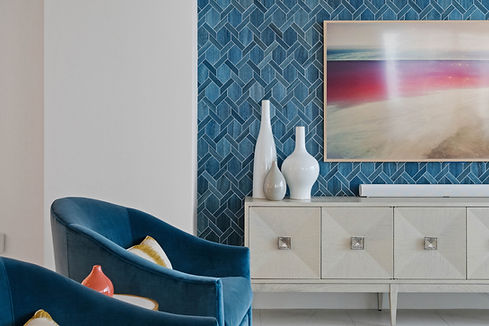 Living room elevated with layered texture and soft, comfortable seating.