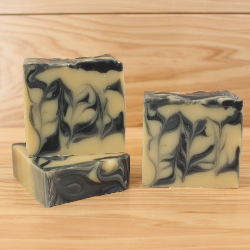 Thumbnail: Three bars of yellow and black vegan, all-natural soap