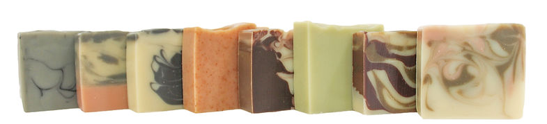 A row of our handcrafted, all-natural and vegan soaps made with certified organic ingredients