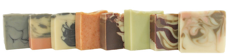 A row of our handcrafted, all-natural and vegan soaps made with certified organic ingredients