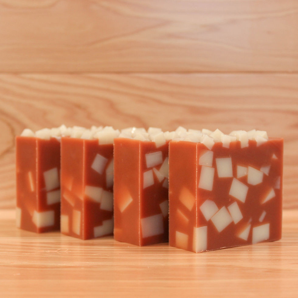 Thumbnail: Handmade orange soap bars with white pieces