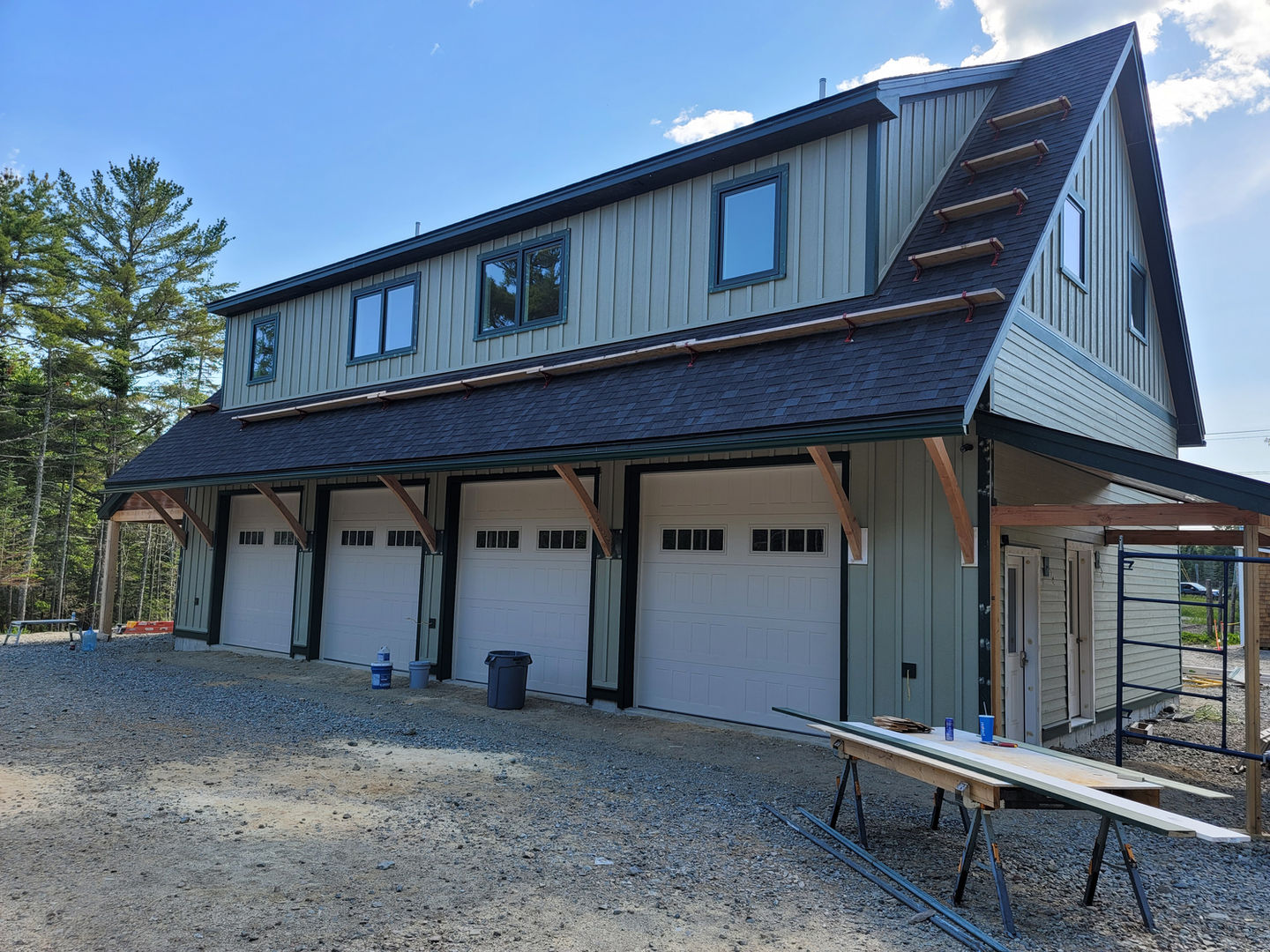 Small building with three garage doors.