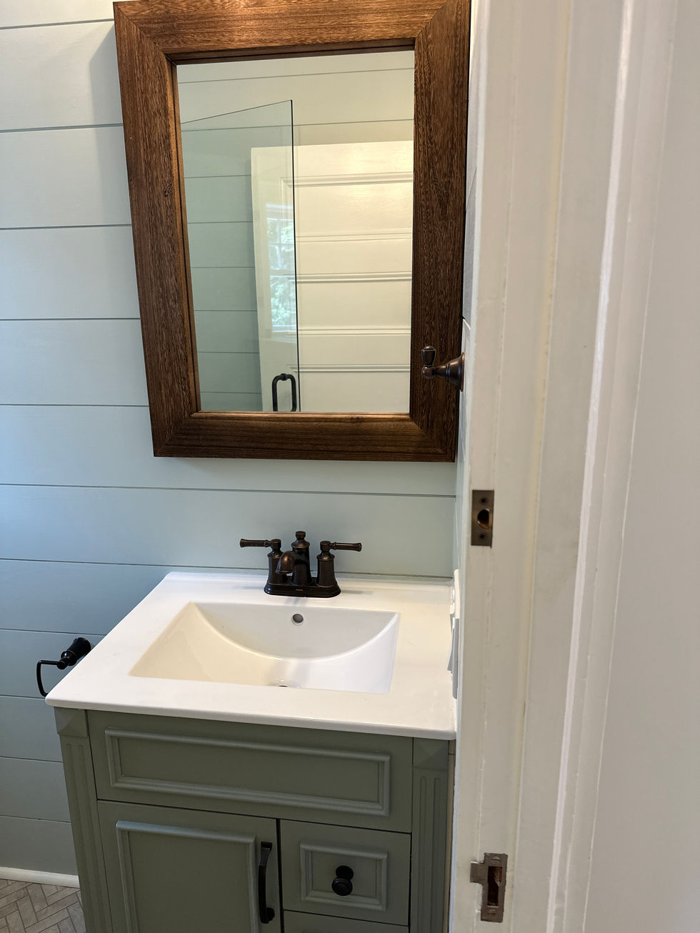 Bathroom vanity with mirror and sink.