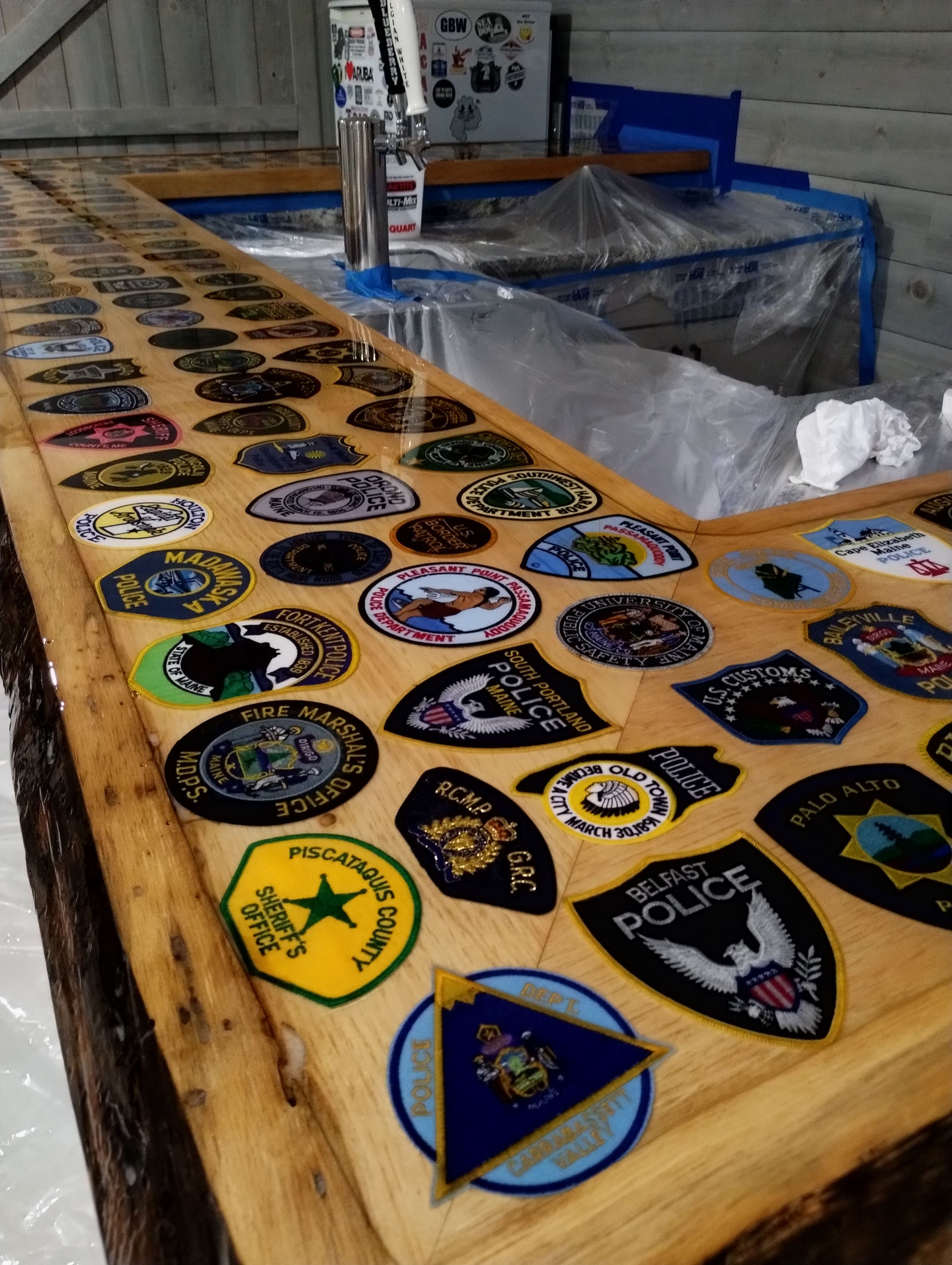 Table covered with various embroidered patches.