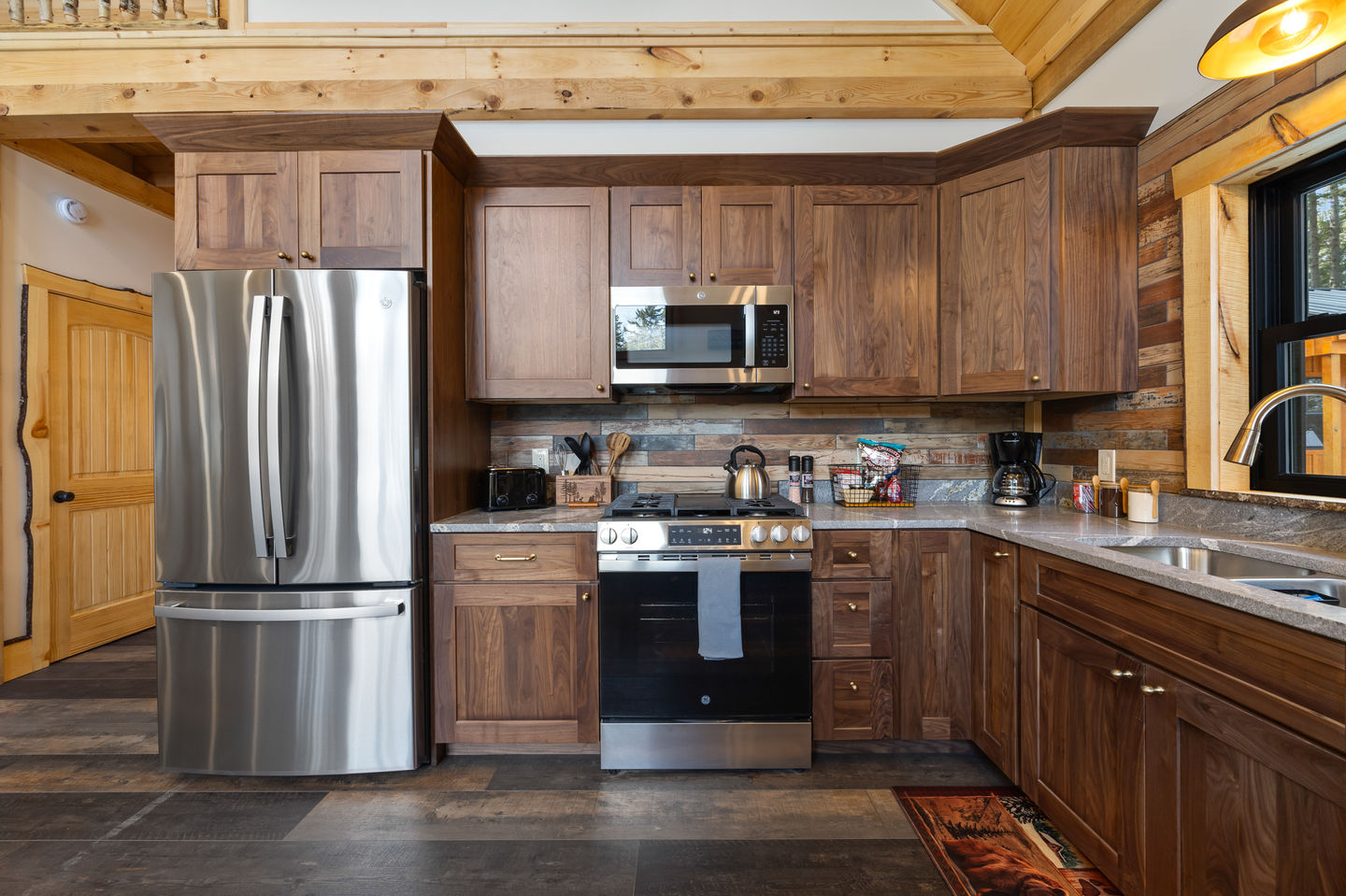Cozy kitchen with wooden cabinets and modern appliances.