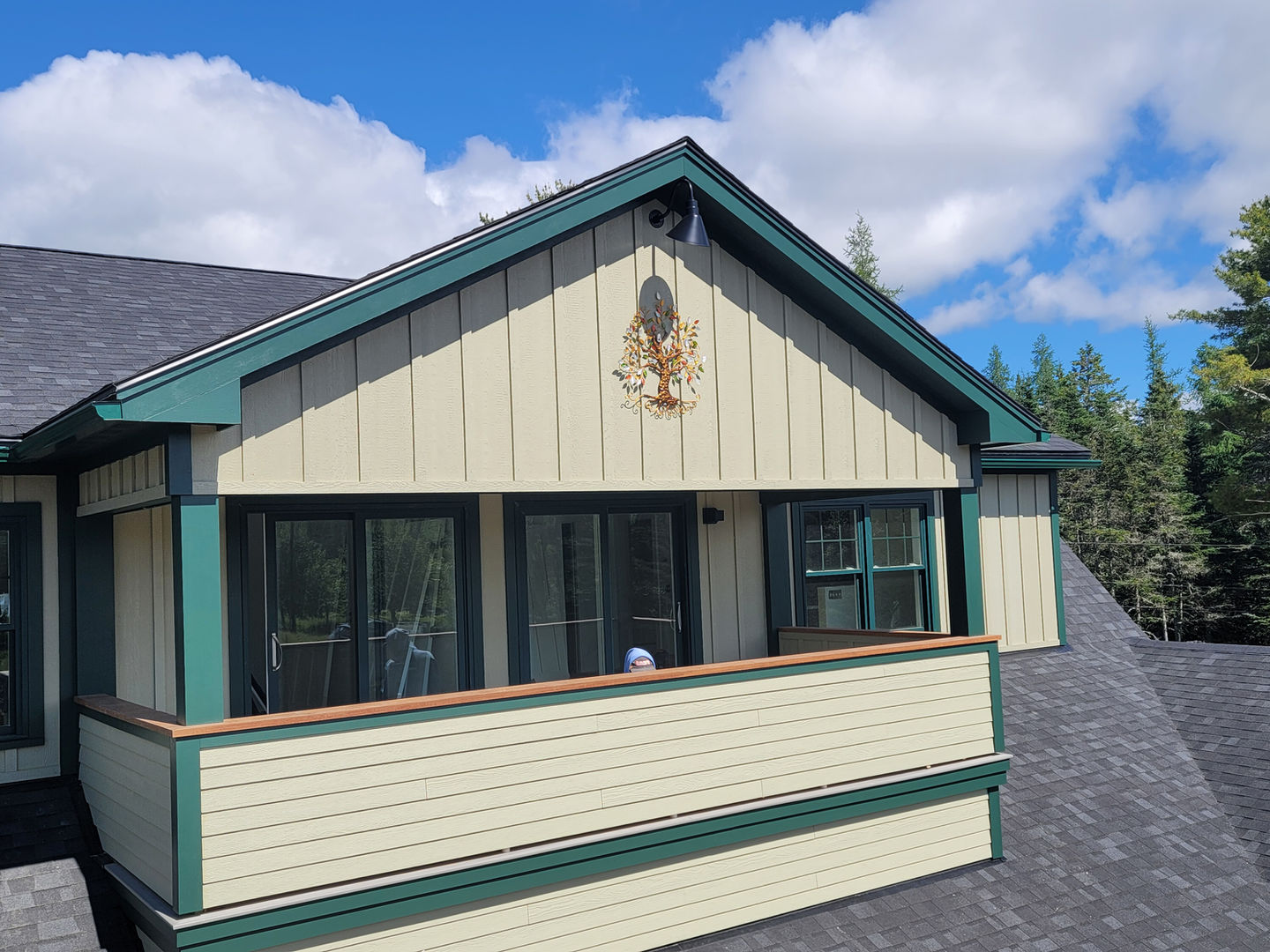 Building with green trim and a decorative emblem.