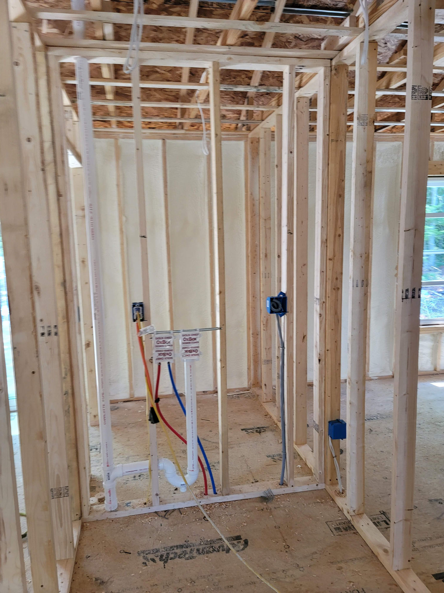 Wooden framing of a building under construction.