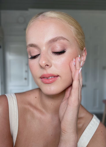 Bridal Hair and Makeup Low Sleek Bun on Blonde Hair 