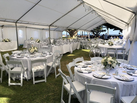 Large at home wedding reception set up tent, tables, chairs, table linen rentals from Gold Star Jumper, in Santa Ana, California.