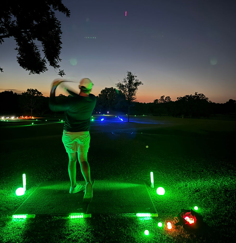 Golfer playing night gol