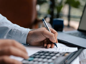 A Person Using a Calculator