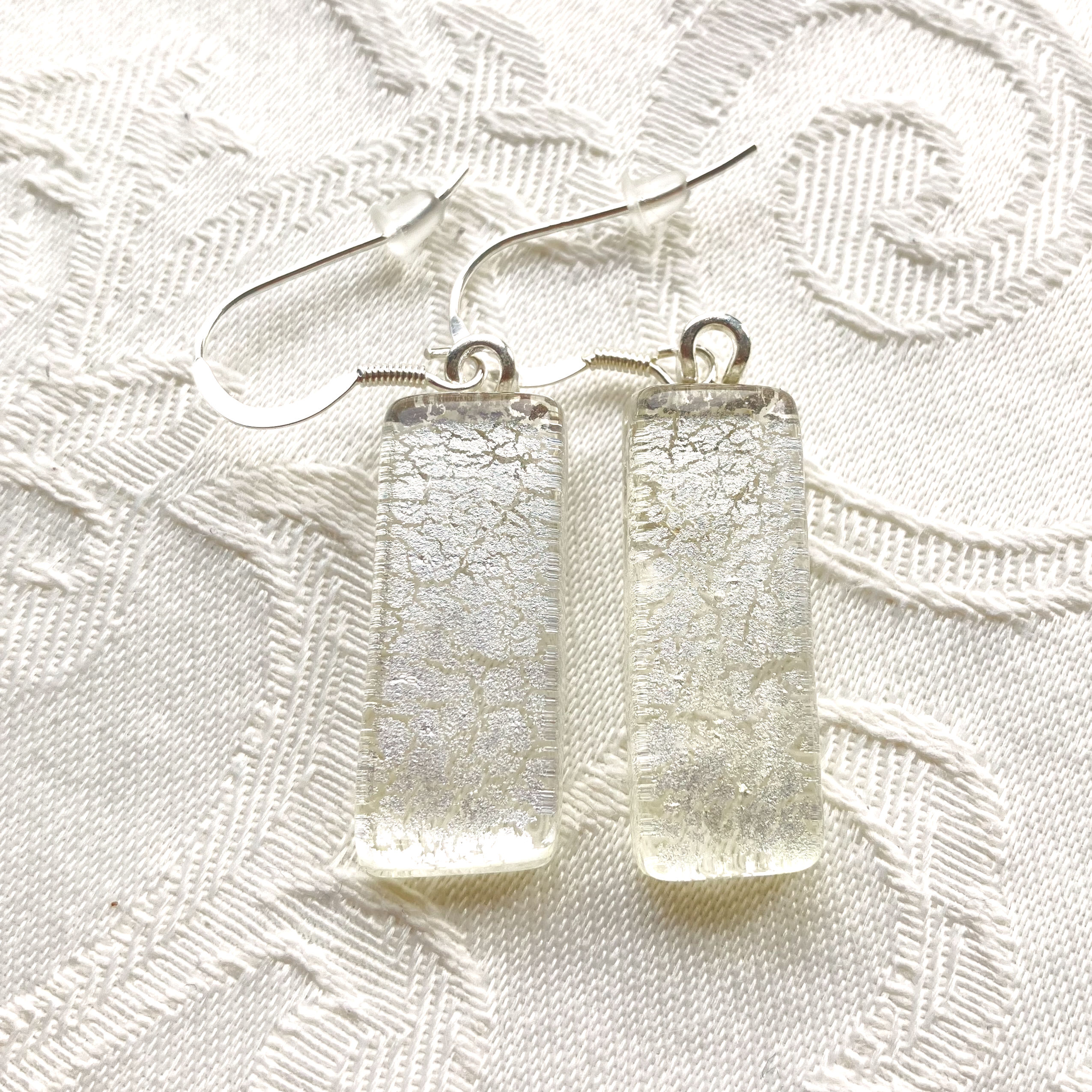 Earrings with the inclusion of silver leaves