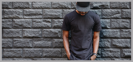 Man wearing a black snapback.Using the companion, mobile magnetic hat holder, the hat pal.