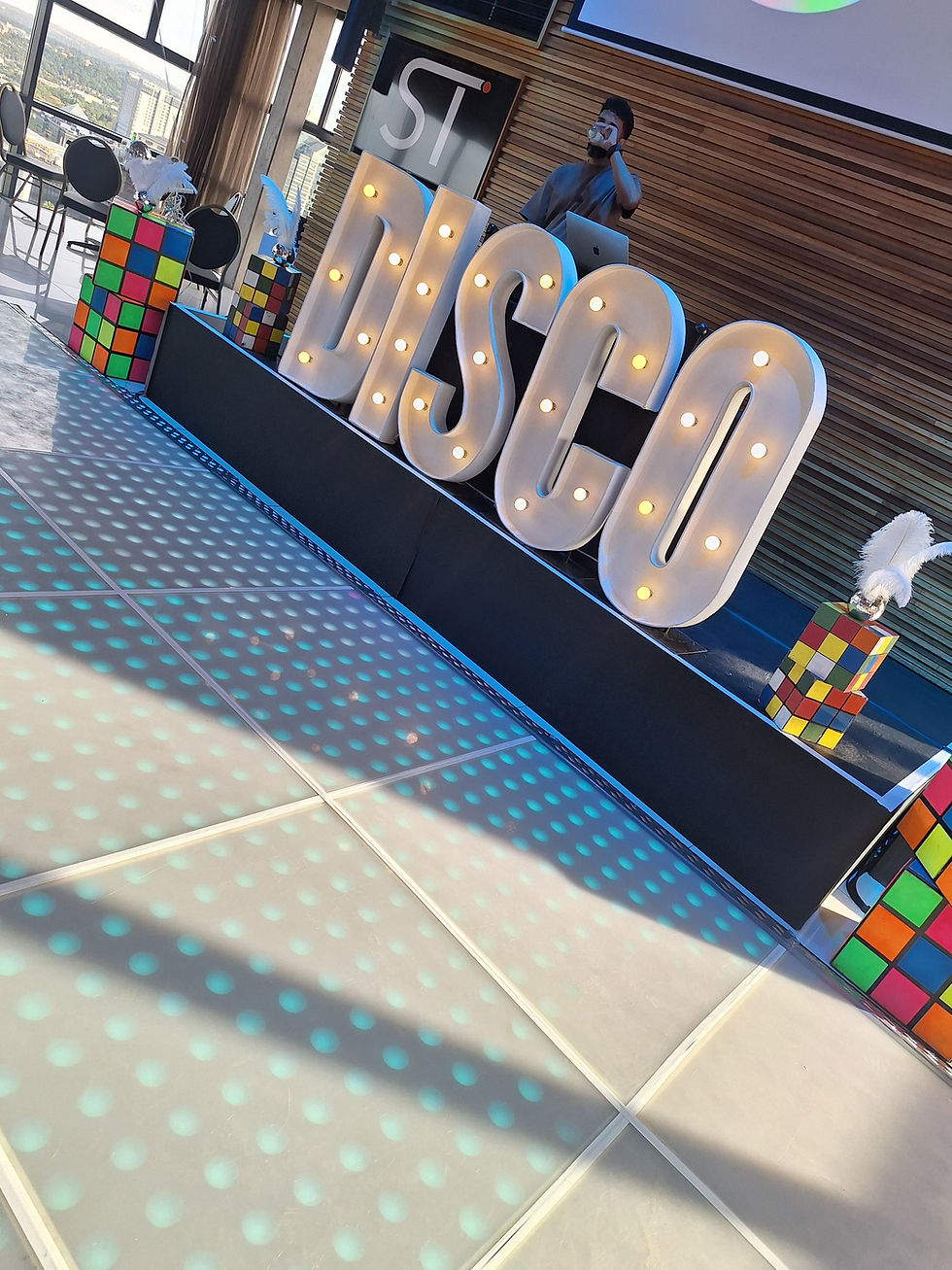 Thumbnail: Disco function combo for 60 guests with neon props, shimmer wall, vinyl records, and table decor for retro-themed parties