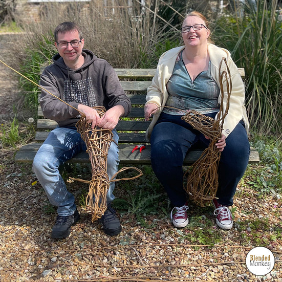 Happy couple enjoying their willow sculpture workshop here in the Blended Monkey gardens