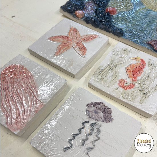 Glazed and fired coasters made by one of our Blended Monkey students