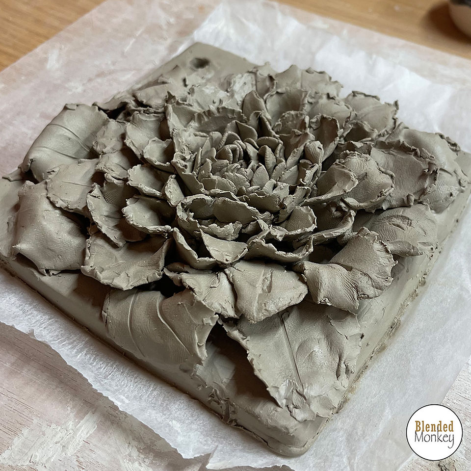Group shot of our clay blossom tile students here in the Blended Monkey Studios