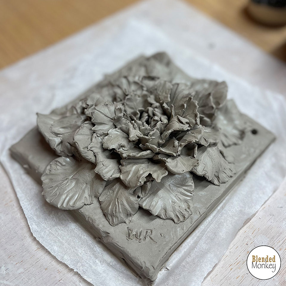 Group shot of our clay blossom tile students here in the Blended Monkey Studios