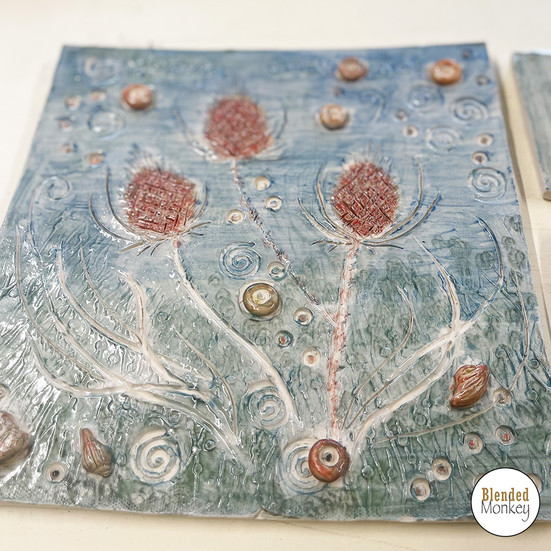 Glazed and fired tile made by one of our Blended Monkey students