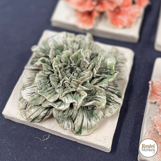 Clay blossom tiles created during a sculpture workshop at Blended Monkey