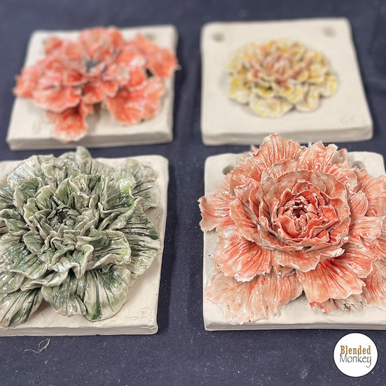 Clay blossom tiles created during a sculpture workshop at Blended Monkey